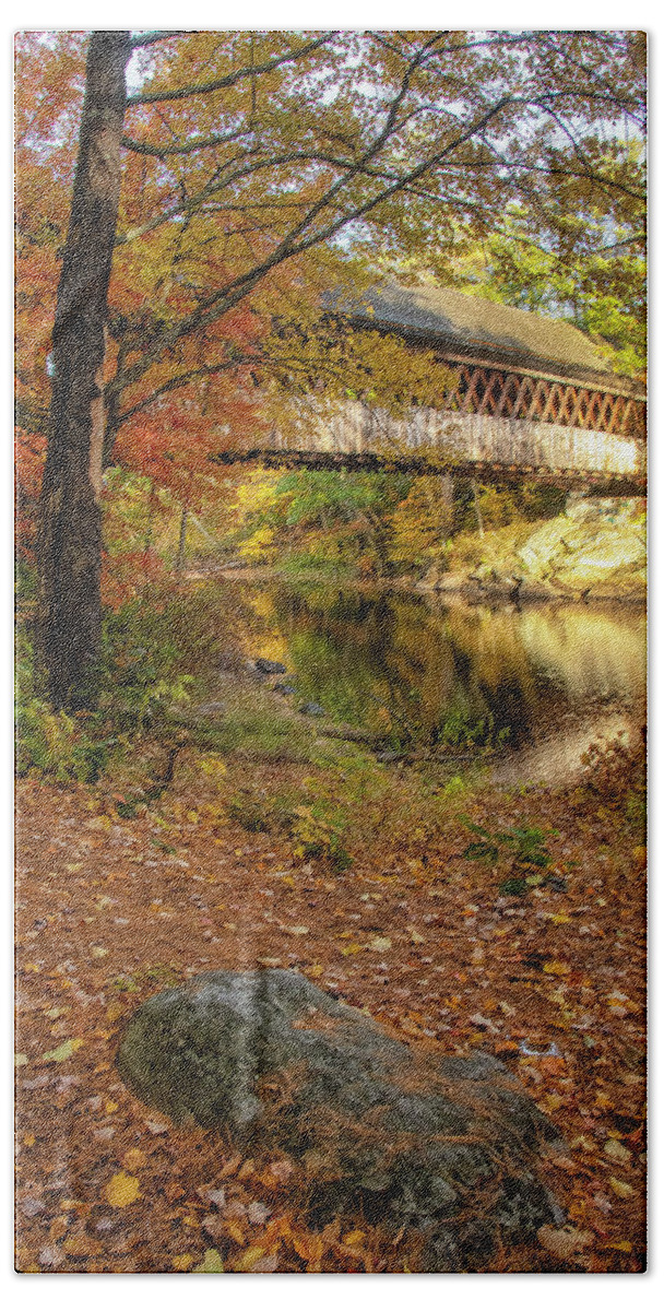 The Gorgeous Henniker Covered Bridge On A Beautiful Fall Day In October Seen Throuh The Woods. Henniker Hand Towel featuring the photograph Covered Bridge in Autumn #1 by Donna Doherty