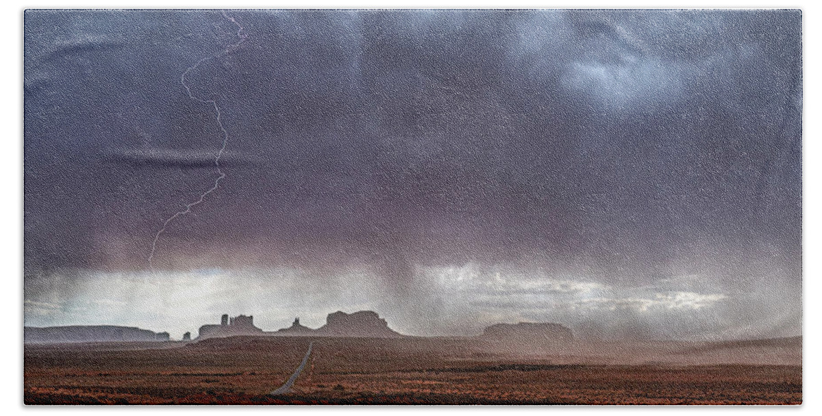 © 2022 Lou Novick All Rights Reversed Bath Towel featuring the photograph Monument Valley Storm by Lou Novick