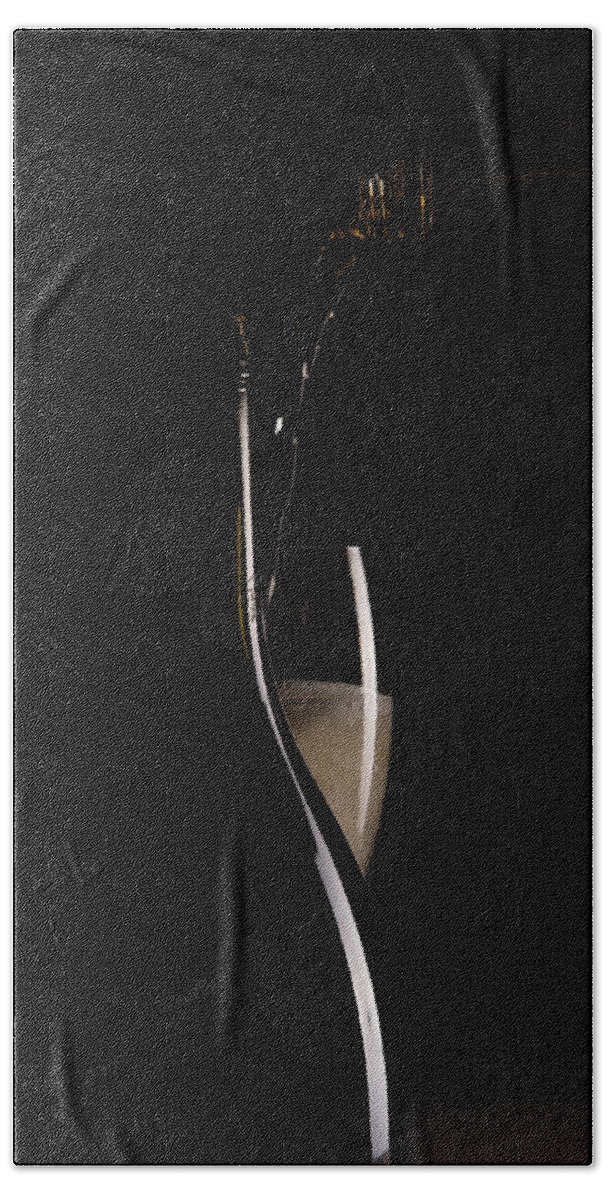 Red Wine Bath Towel featuring the photograph Red sparking wine on a wineglass and black wine bottle. #1 by Michalakis Ppalis