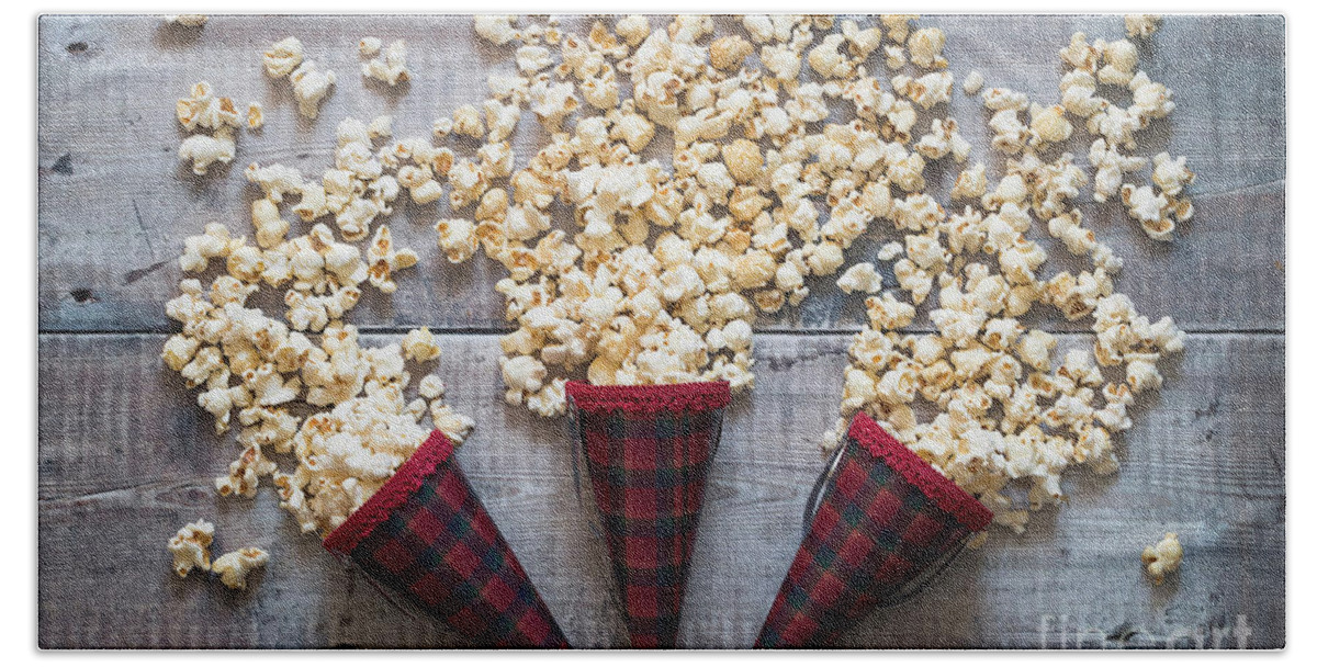 Food Hand Towel featuring the photograph Three popcorn cones flat lay #1 by Jane Rix