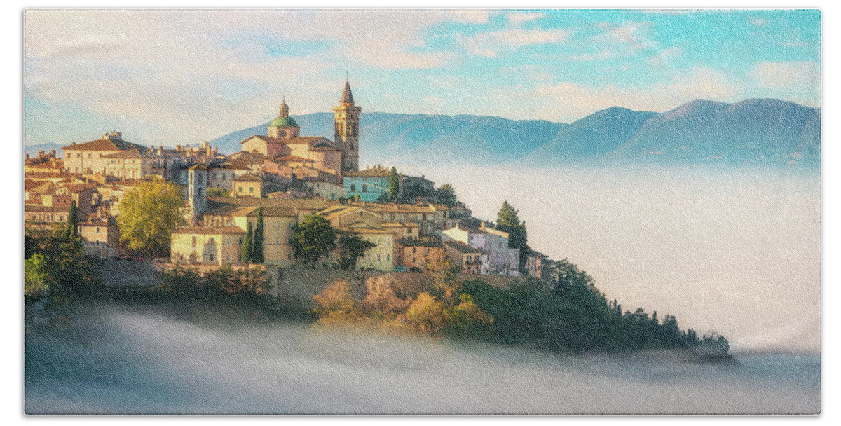 Trevi Bath Towel featuring the photograph Trevi picturesque village in a foggy morning. Perugia, Umbria, I by Stefano Orazzini