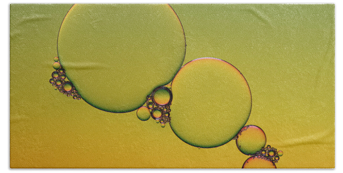 Connection Bath Towel featuring the photograph Bright abstract, yellow background with flying bubbles by Michalakis Ppalis