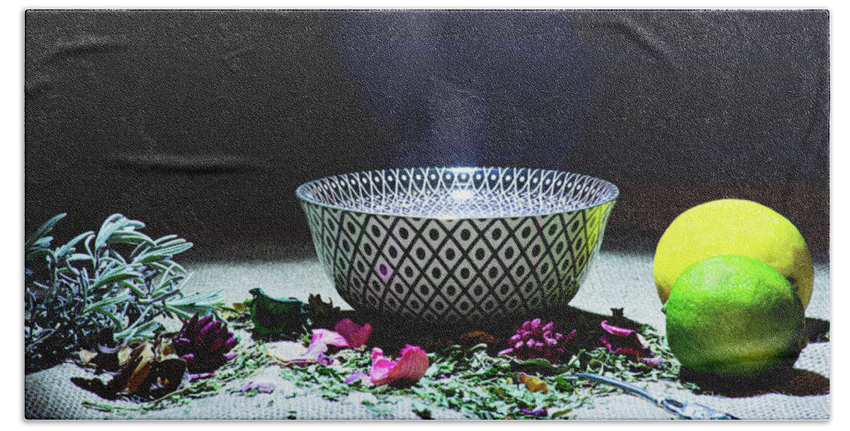 Tea Hand Towel featuring the photograph A drinking bowl with tea and herbs. by Bernhard Schaffer