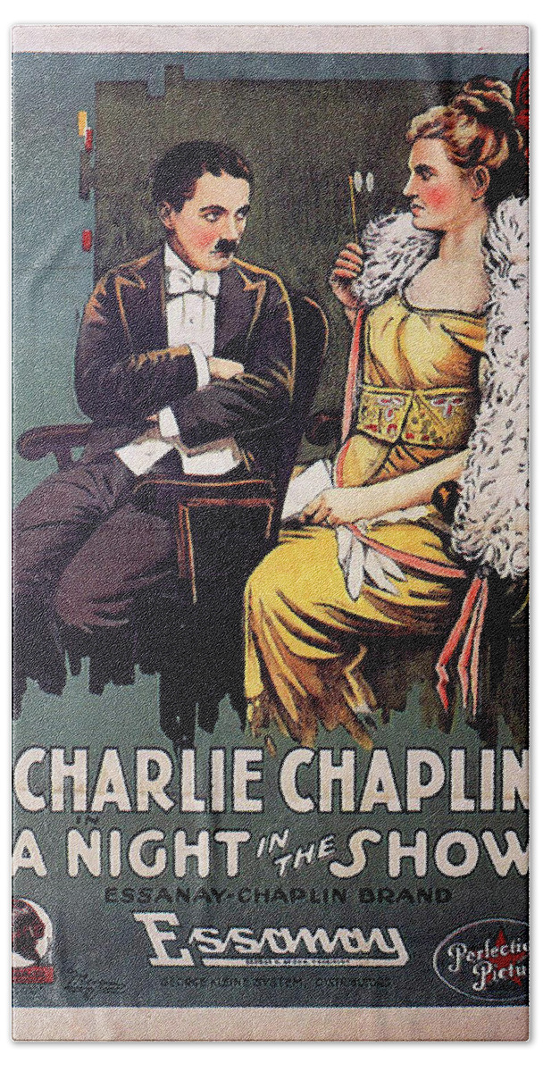 Charlie Chaplin Bath Towel featuring the mixed media ''A Night in the Show'' 1915 by Movie World Posters