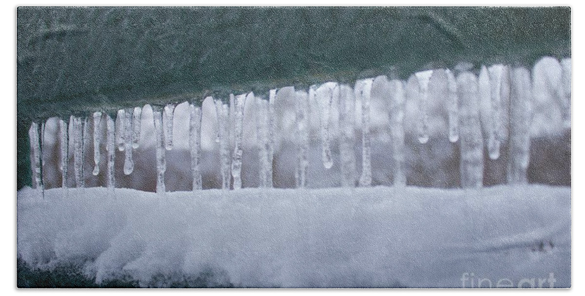 Snow Bath Towel featuring the photograph A row of icicles by Yvonne M Smith
