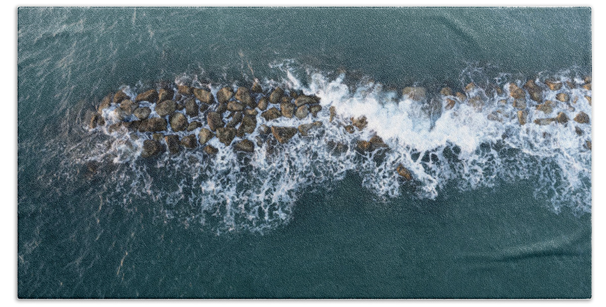 Ocean Bath Towel featuring the photograph Aerial view from a flying drone of blue sea water and break water. Sea wall coastline by Michalakis Ppalis