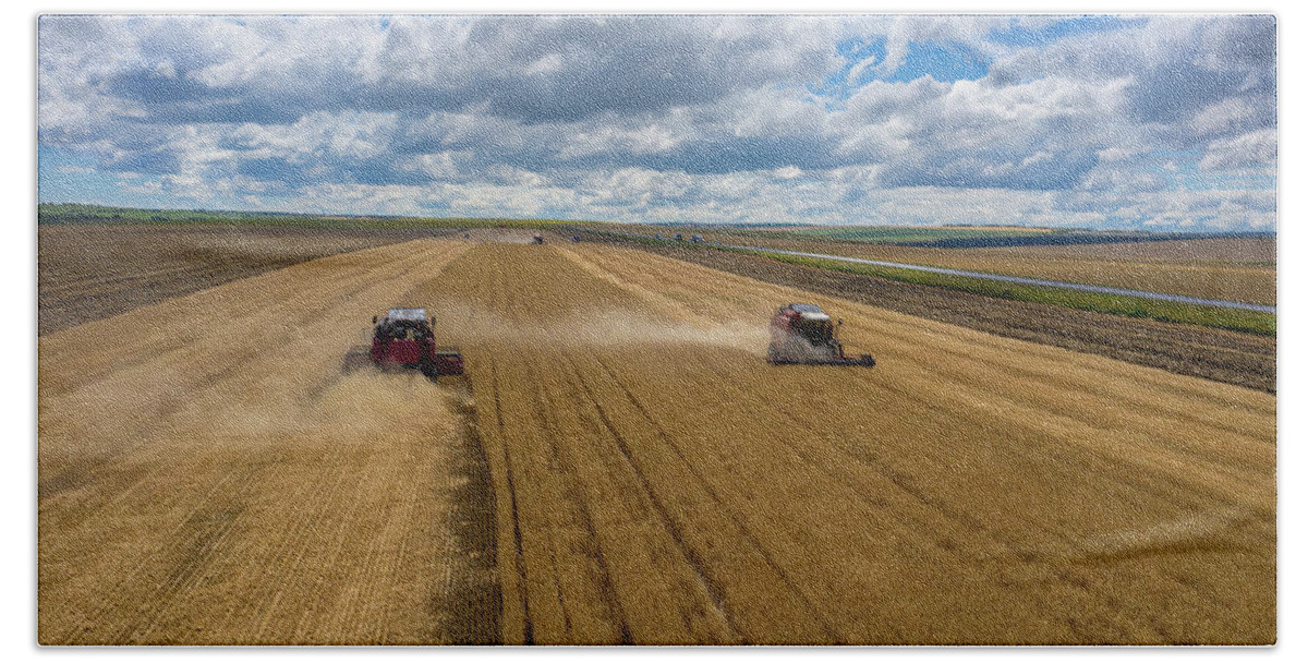 Agriculture Hand Towel featuring the photograph Aerial view of combine on harvest field by Mikhail Kokhanchikov
