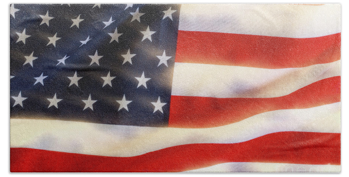 4th Bath Towel featuring the photograph American flag waving in the wind by Simon Bratt