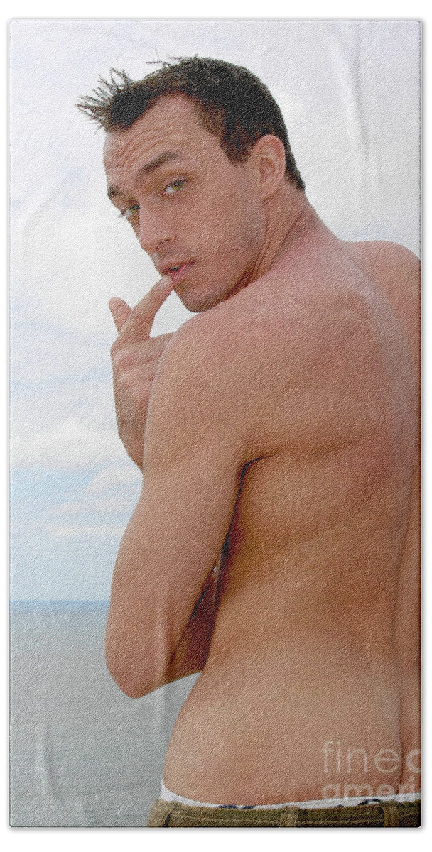 Beach Hand Towel featuring the photograph Attractive, muscular, and silly male model pulls down his pants... by Gunther Allen