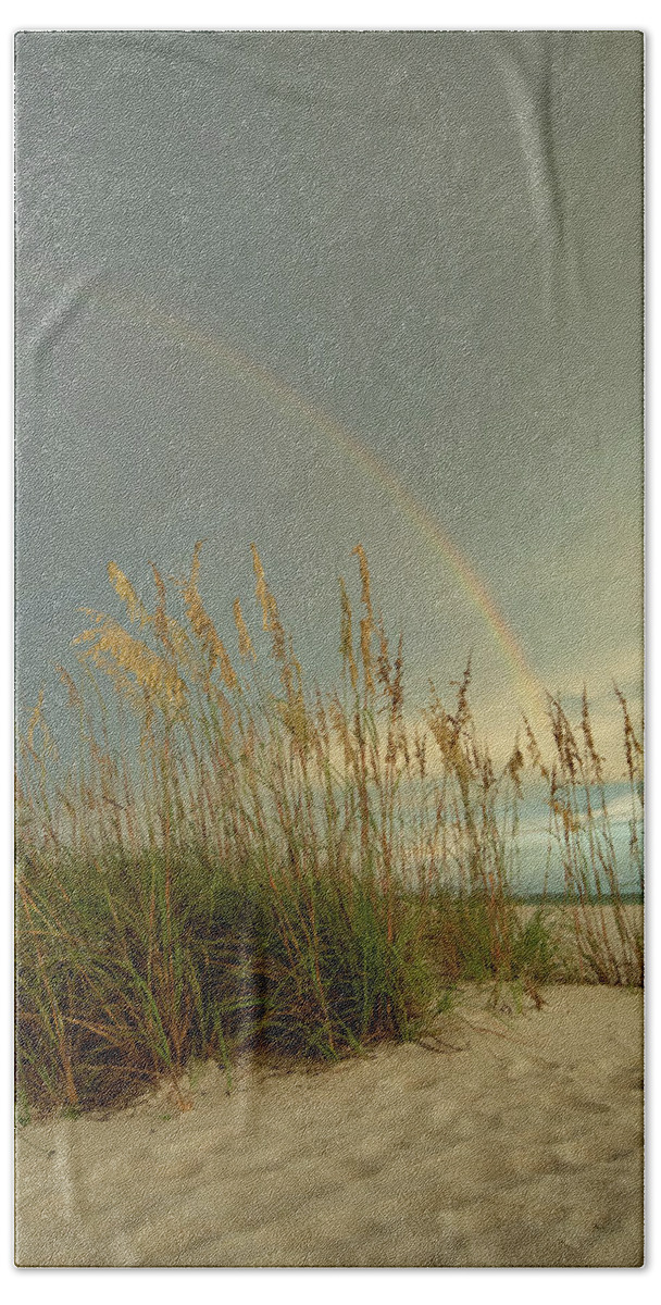 Beach Hand Towel featuring the photograph Beach Rainbow by Carolyn Hutchins