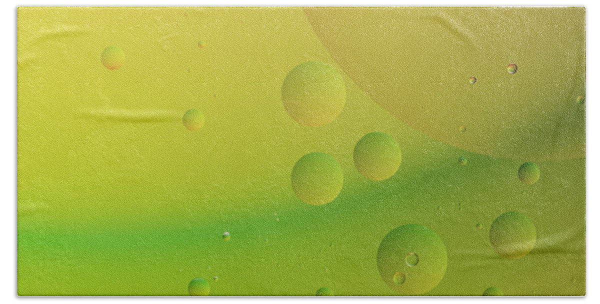 Connection Bath Towel featuring the photograph Bright abstract green and yellow background with flying bubbles by Michalakis Ppalis