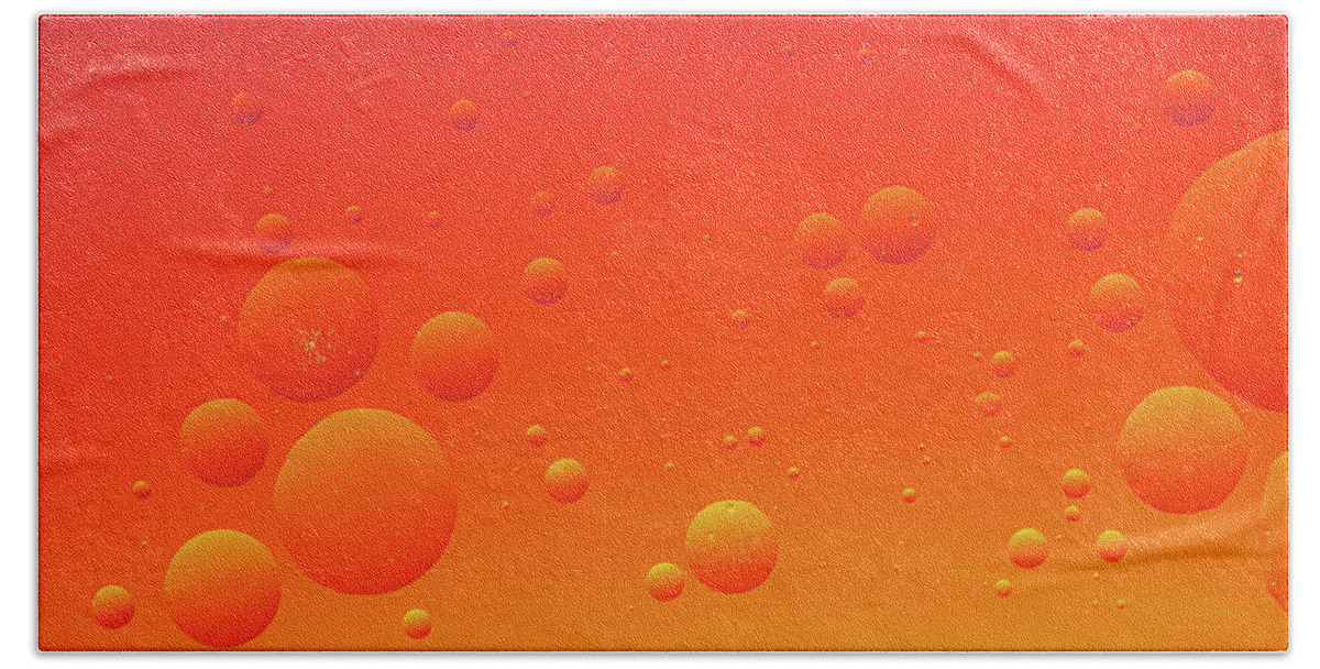 Abstract Bath Towel featuring the photograph Bright abstract, red background with flying bubbles by Michalakis Ppalis