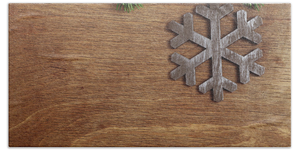 Christmas Bath Towel featuring the mixed media Christmas Wooden Background With Snowflake by Mikhail Kokhanchikov
