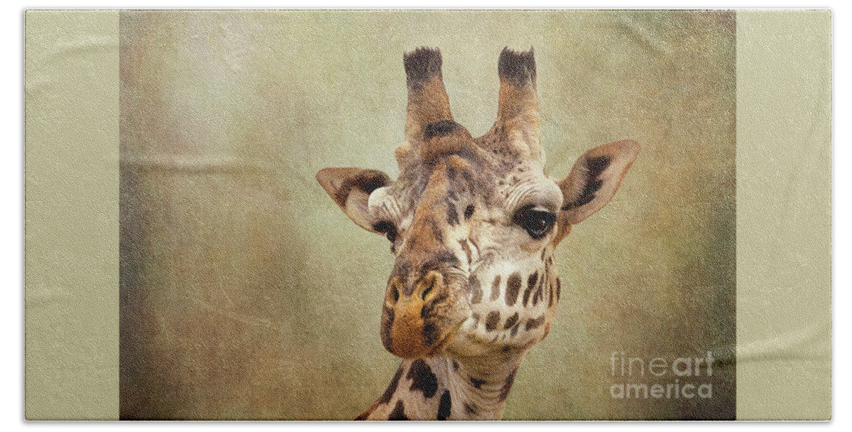 Giraffe Bath Towel featuring the photograph Closeup of the head of a giraffe. by Jane Rix