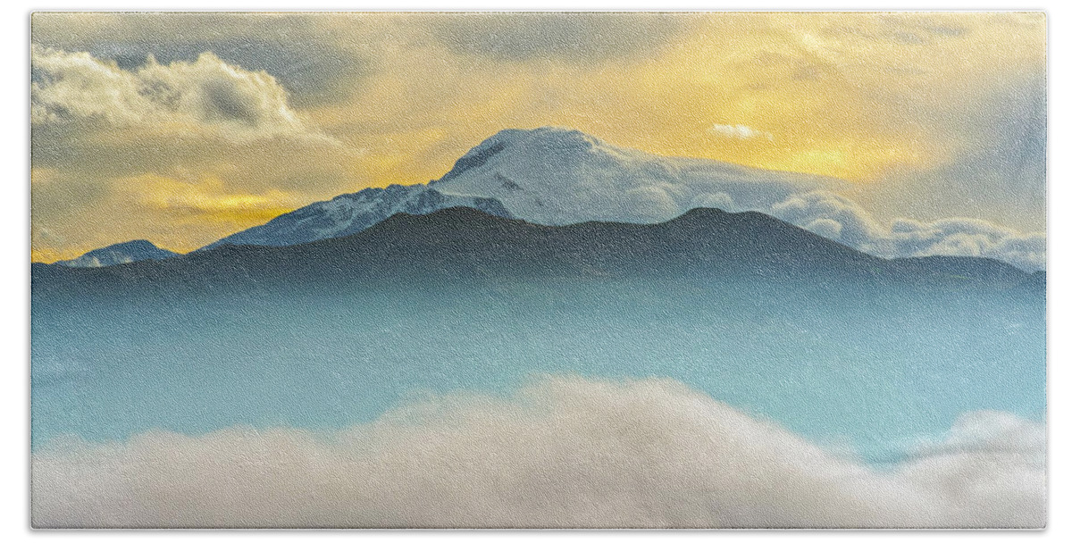 Andes Hand Towel featuring the photograph Cloud bank and sunrise on the Cayambe volcano by Henri Leduc
