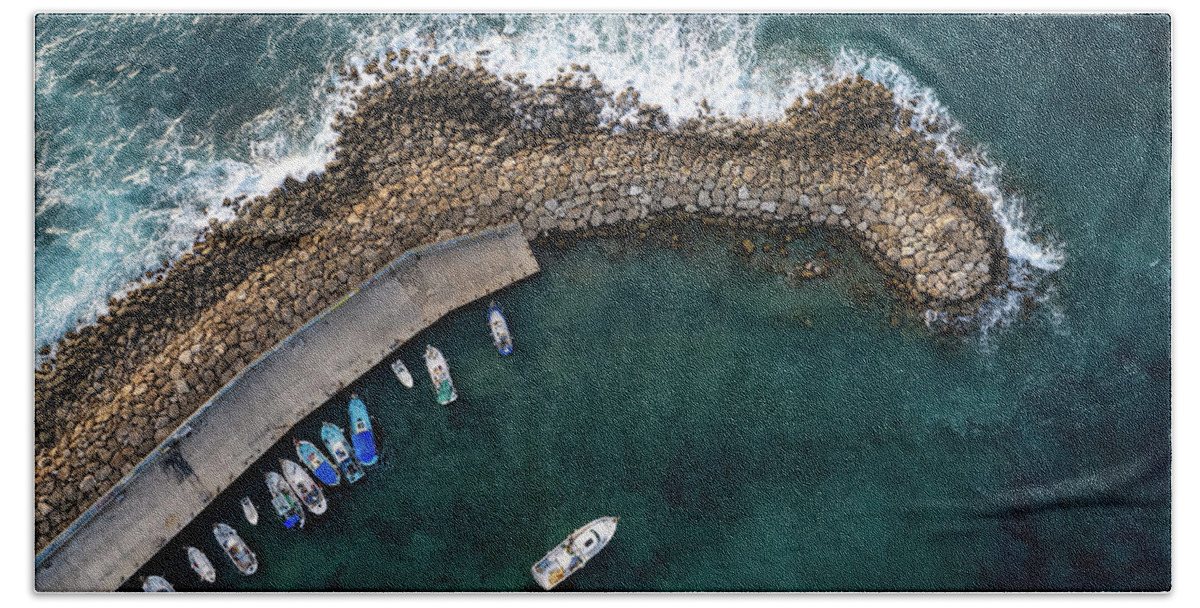 Fishing Harbor Bath Towel featuring the photograph Drone aerial fishing harbour with boats stormy waves, blue sea by Michalakis Ppalis