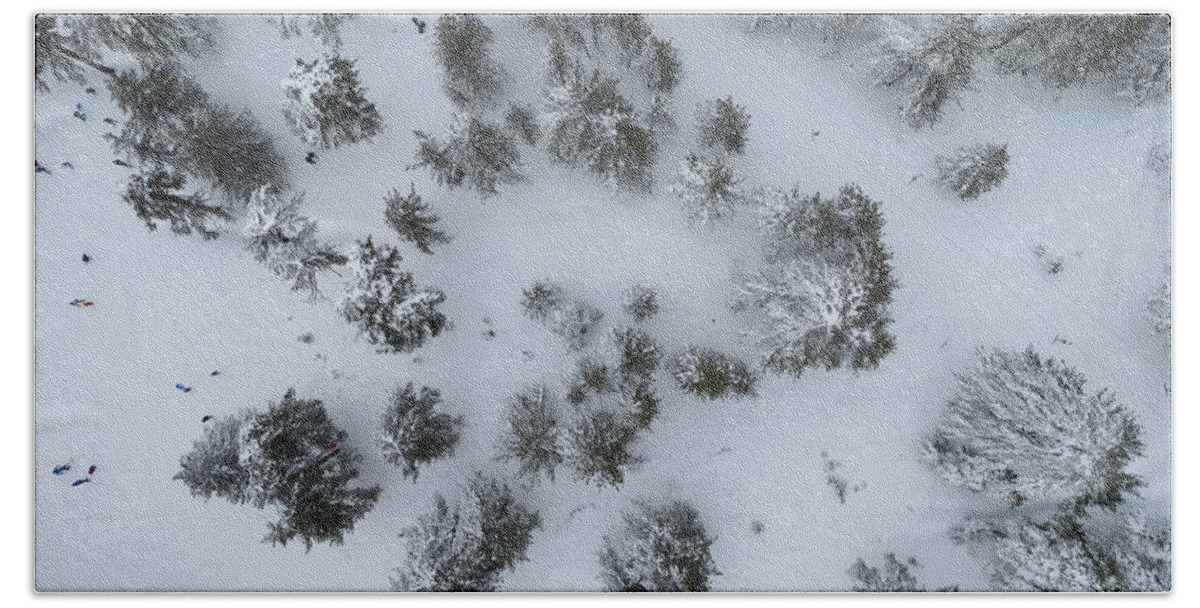 Winter Bath Towel featuring the photograph Drone aerial scenery of mountain snowy forest and people playing in snow. Wintertime season by Michalakis Ppalis