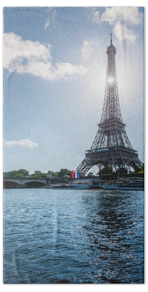 Paris Hand Towel featuring the photograph Eiffel Tower against sun by Philippe Lejeanvre