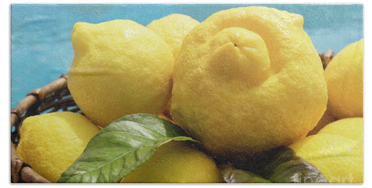 Lemon Tree Bath Towel featuring the photograph Sunny yellow lemons in a basket by Adriana Mueller