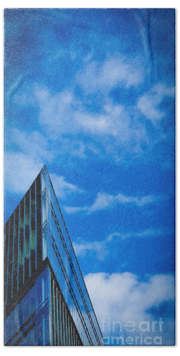 Building Hand Towel featuring the photograph Futuristic triangular building against a clear blue sky by Mendelex Photography