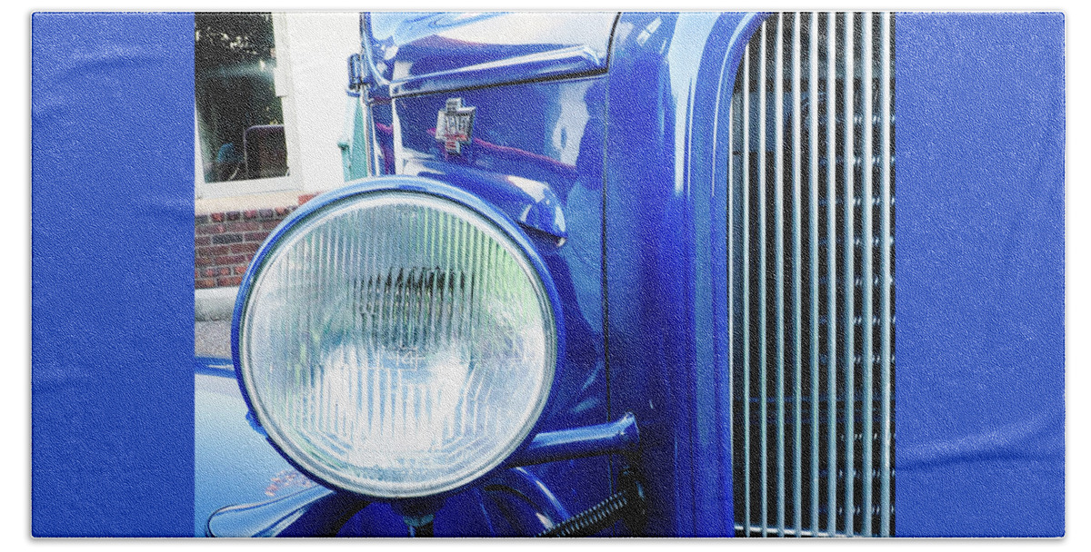 Car Hand Towel featuring the photograph Grill and Headlight with a Blue Car Attached by James C Richardson
