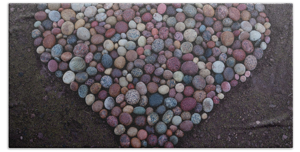  Hand Towel featuring the sculpture Heart Of Stones by Pontus Jansson