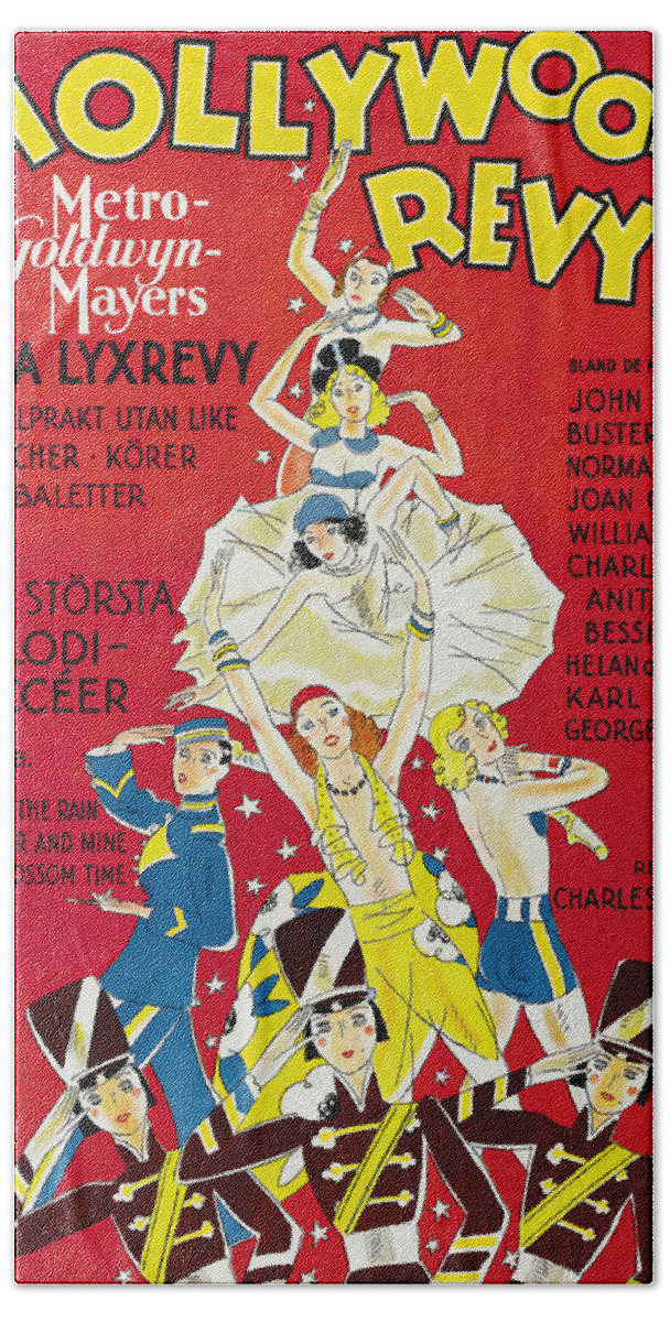 Hollywood Hand Towel featuring the mixed media ''Hollywood Revue of 1929'' by Movie World Posters