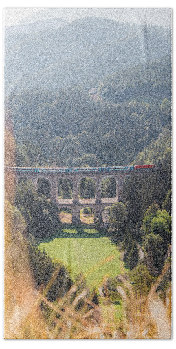 Semmering Bath Towel featuring the photograph Kalte Rinne railway viaduct and a passing train in Semmering, Austria by Vaclav Sonnek