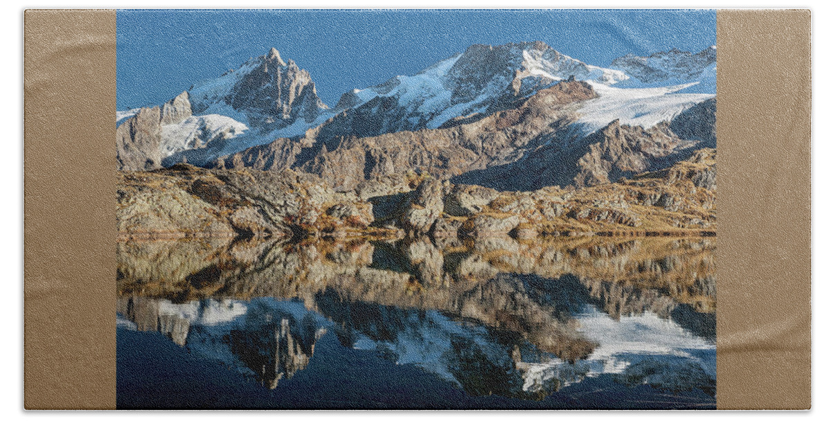 Lake Bath Towel featuring the photograph La Meije peak mirrored in Lake Lerie by Olivier Parent