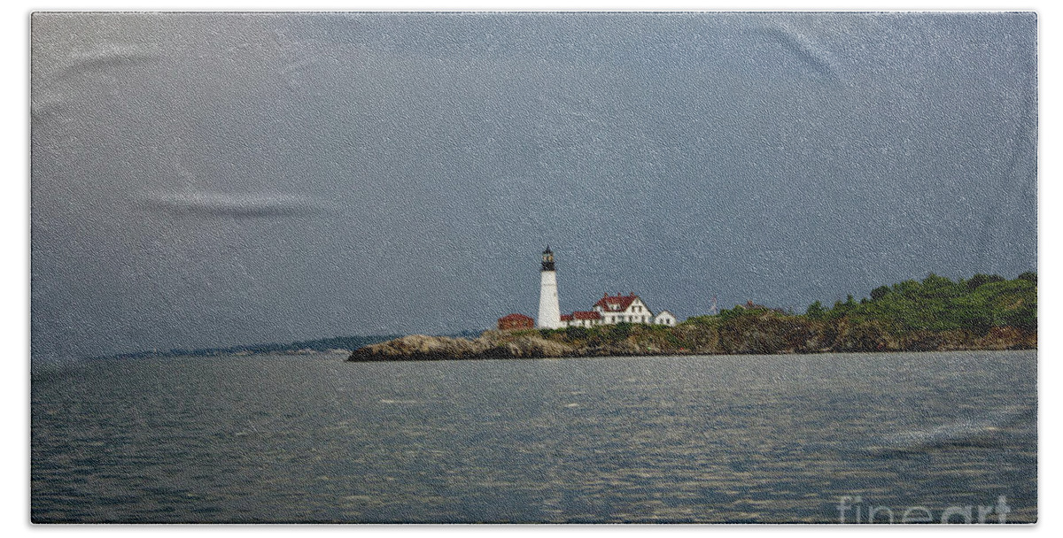 Portland Headlight Hand Towel featuring the pyrography Lighthouse before the storm by Annamaria Frost