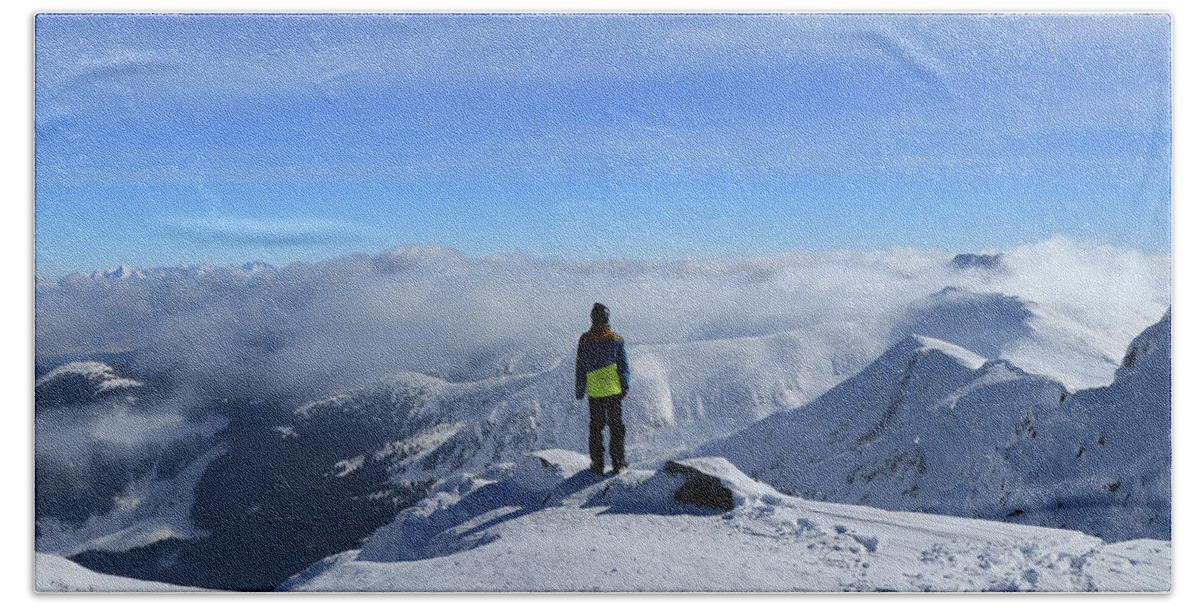 View Bath Towel featuring the photograph Magical panorama on peak of Chopok with view to High Tatras and Dumbier. Young skier enjoy freedom and paradise looks. Man in colorful ski clothes stand on the edge of mountain and watchs landscape by Vaclav Sonnek