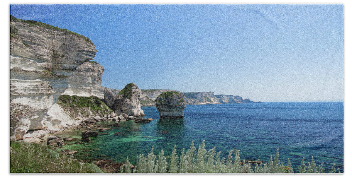 Bay Bath Towel featuring the photograph Mediterranean sea in front of the Bonifacio Cliff by Jean-Luc Farges