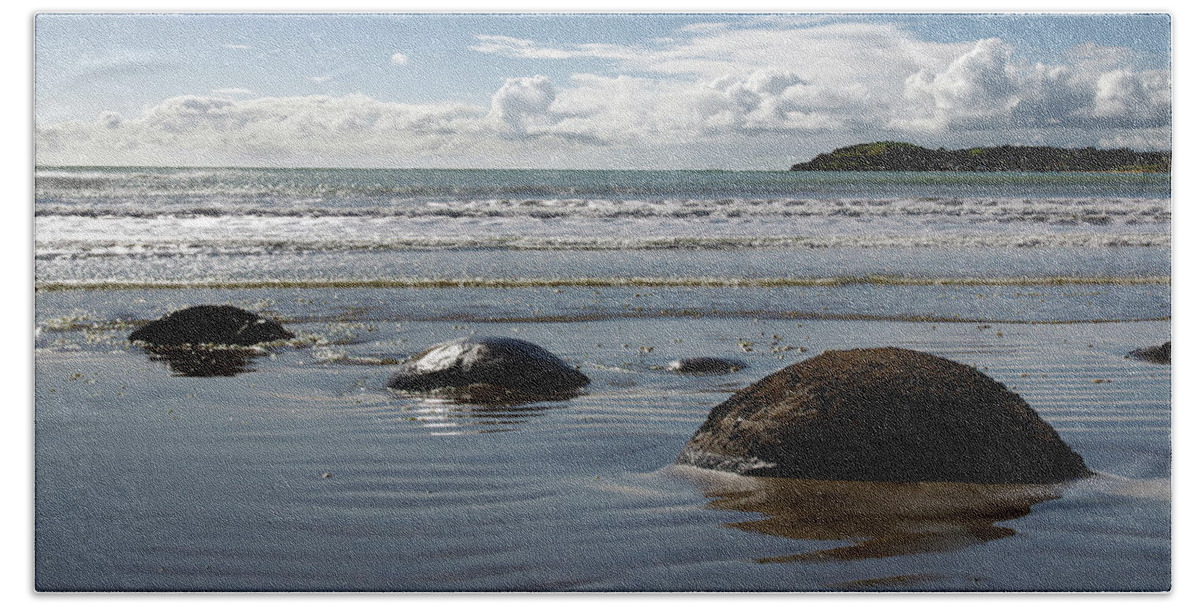 Seascape Hand Towel featuring the photograph Moeraki Boulders - Strange stone balls in Ocean located in New Zealand by Kenneth Lane Smith