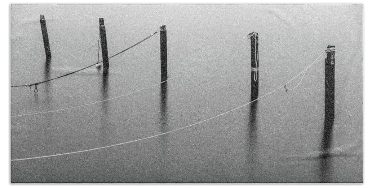 Mooring Bath Towel featuring the photograph Mooring Poles in Black and White by Nicklas Gustafsson