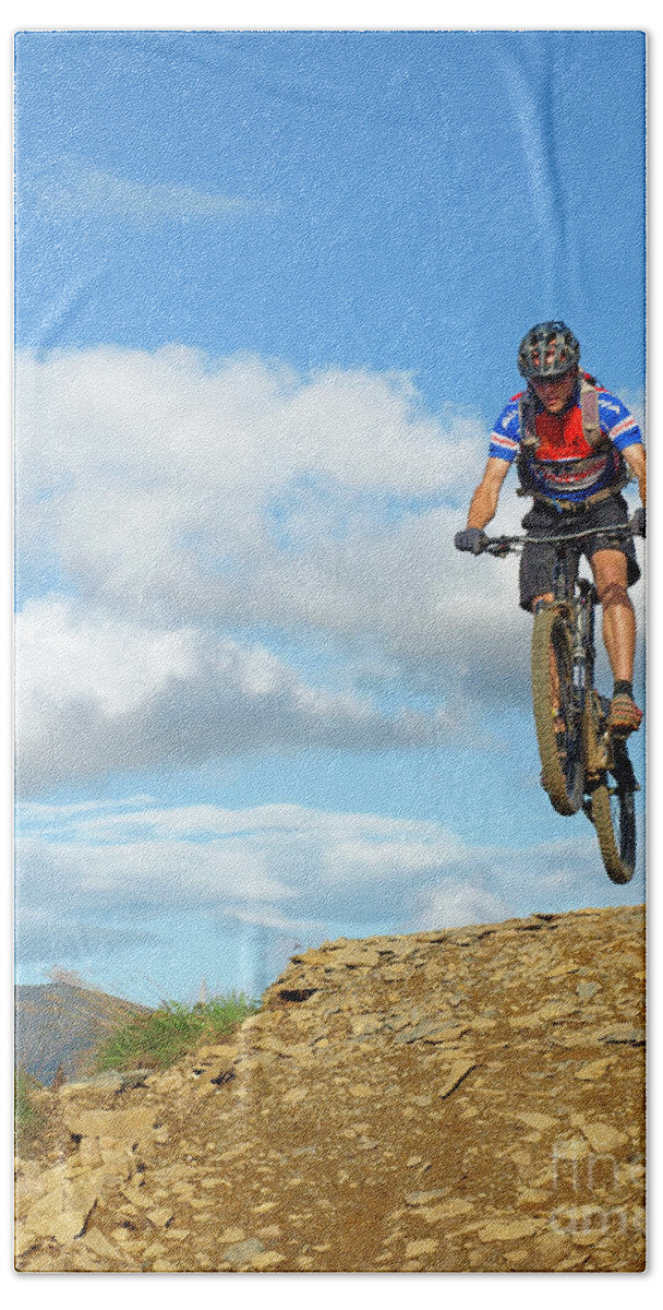 Mountain Bath Towel featuring the photograph Moutain biker jumping by Robert Douglas