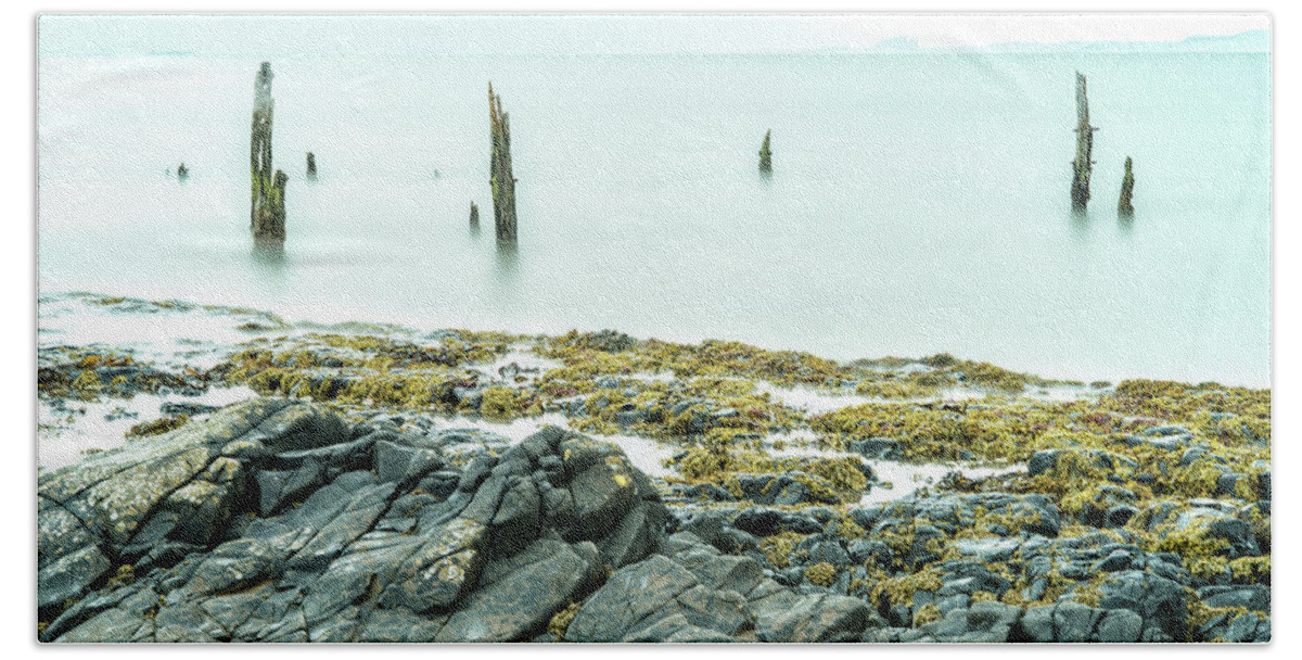 Holy Island Bath Towel featuring the photograph Old Posts and the Rocks - wide angle view by John Paul Cullen