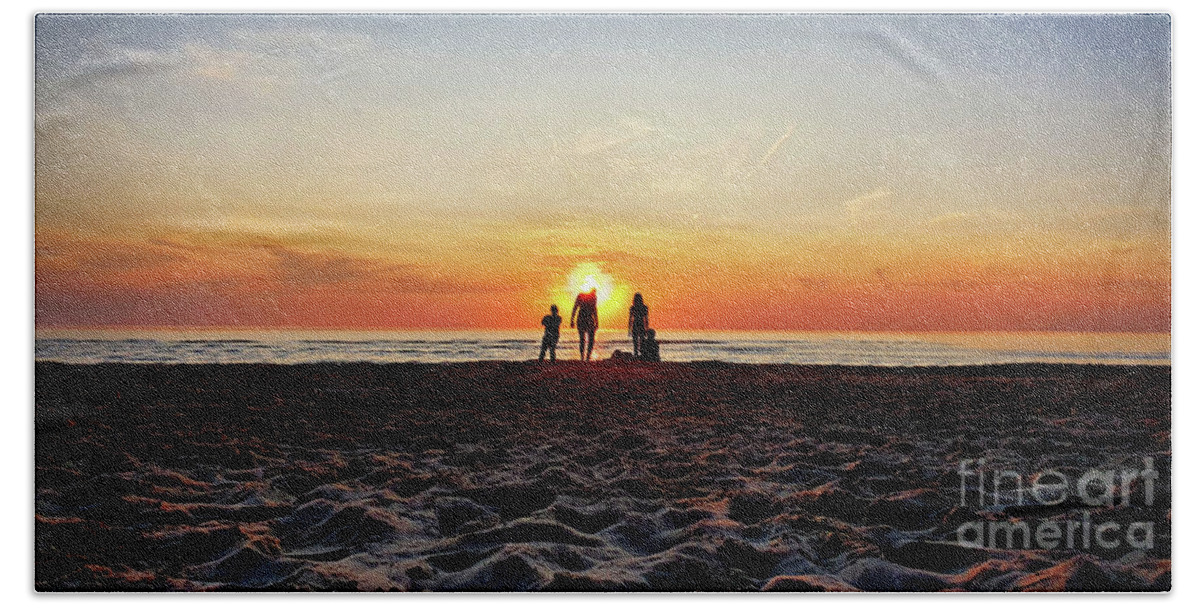 Sunset Hand Towel featuring the photograph People at the beach during golden sunset on the North Sea in Netherlands by Mendelex Photography
