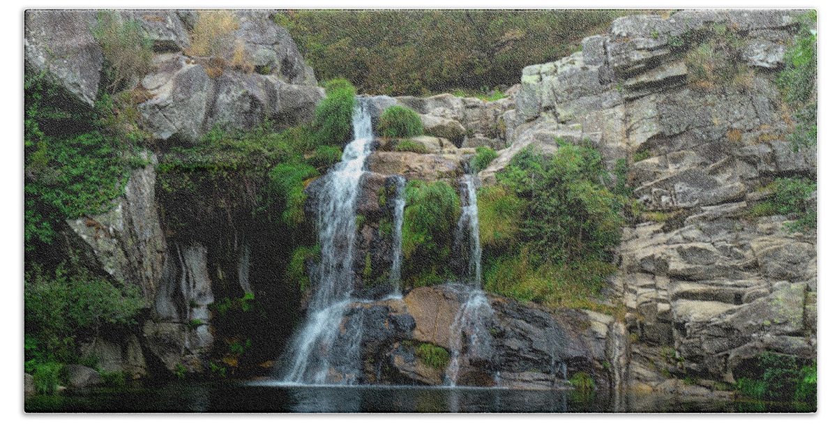 Waterfall Hand Towel featuring the photograph Poco Negro waterfall in Carvalhais by Angelo DeVal