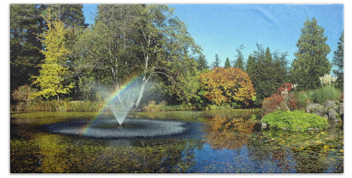 Alex Lyubar Bath Towel featuring the photograph Rainbow in the fountain by Alex Lyubar