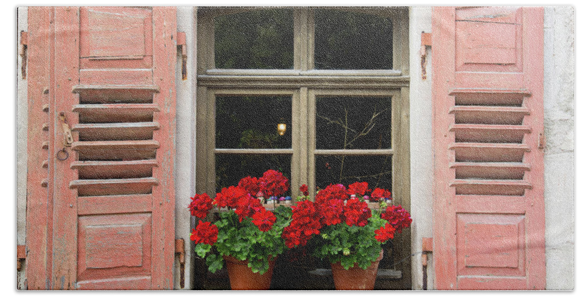 Window Bath Towel featuring the photograph Red flowers and red shutters by Karen Kaspar