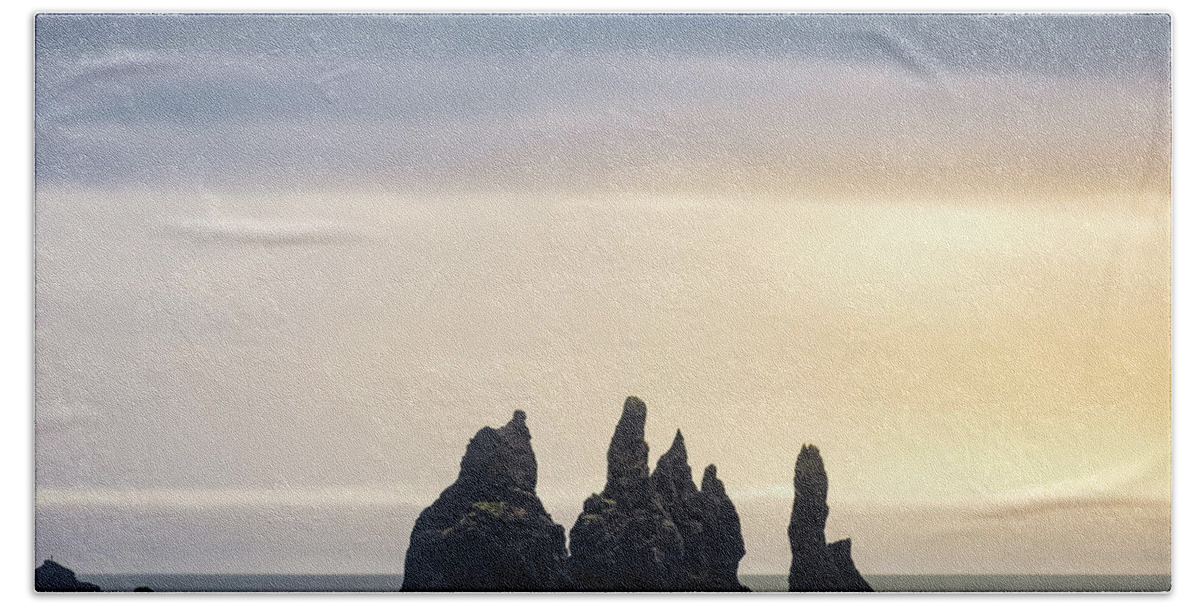 Reynisdrangar Hand Towel featuring the photograph Reynisdrangar basalt sea stacks sunset in Iceland by Alexios Ntounas