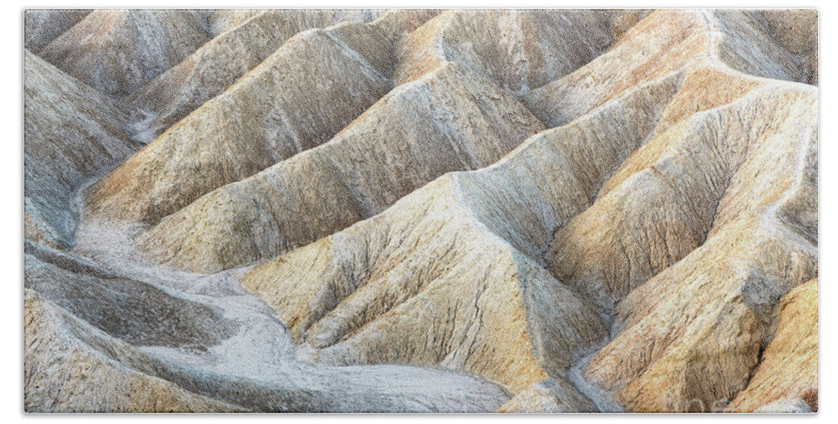 Death Valley Bath Towel featuring the photograph Ripples of eroded stone at Zabriskie Point, Death Valley, California. by Jane Rix