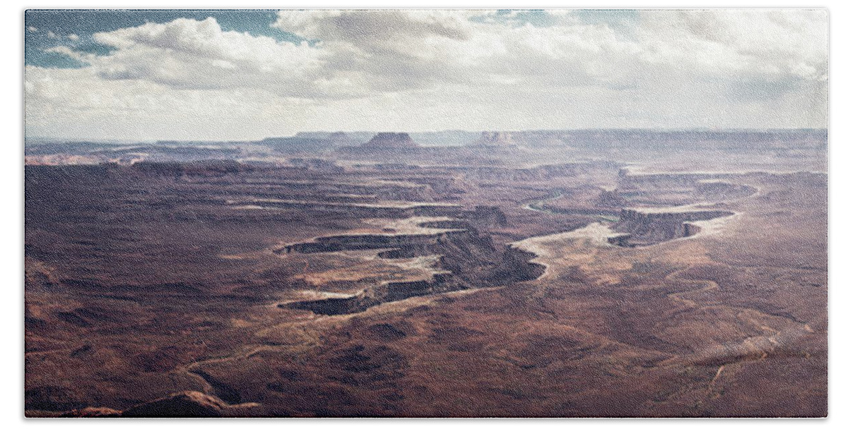 America Bath Towel featuring the photograph Scenic view in canyonland with storm in the distance by Jean-Luc Farges