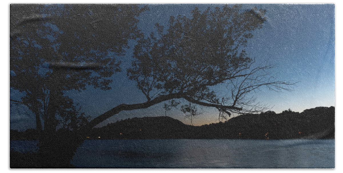 Cottage Hand Towel featuring the photograph Silhouetted Tree over a Lake by John Twynam