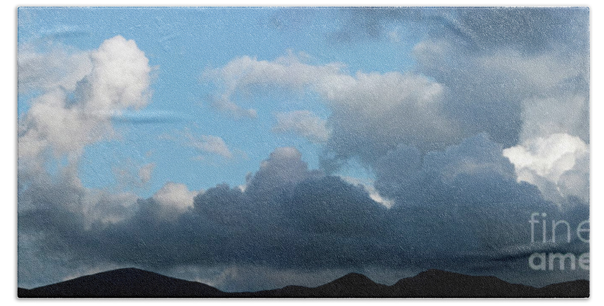 Storm Bath Towel featuring the photograph Storm clouds above mountains by Robert Douglas