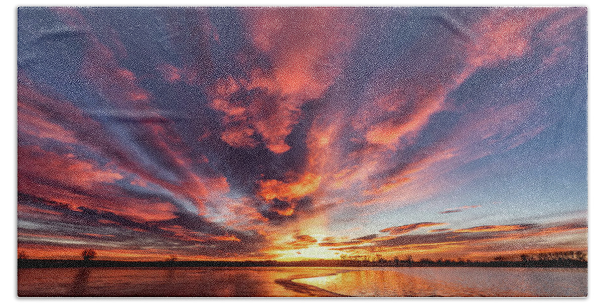 Sunrise Hand Towel featuring the photograph Sunrise Over a Half Frozen Lake by Tony Hake