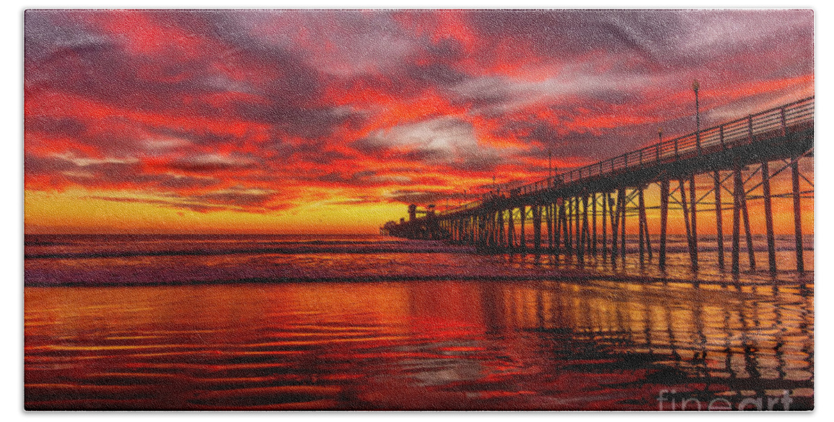 Fiery Bath Towel featuring the photograph Sunset Reflections in Oceanside by Rich Cruse
