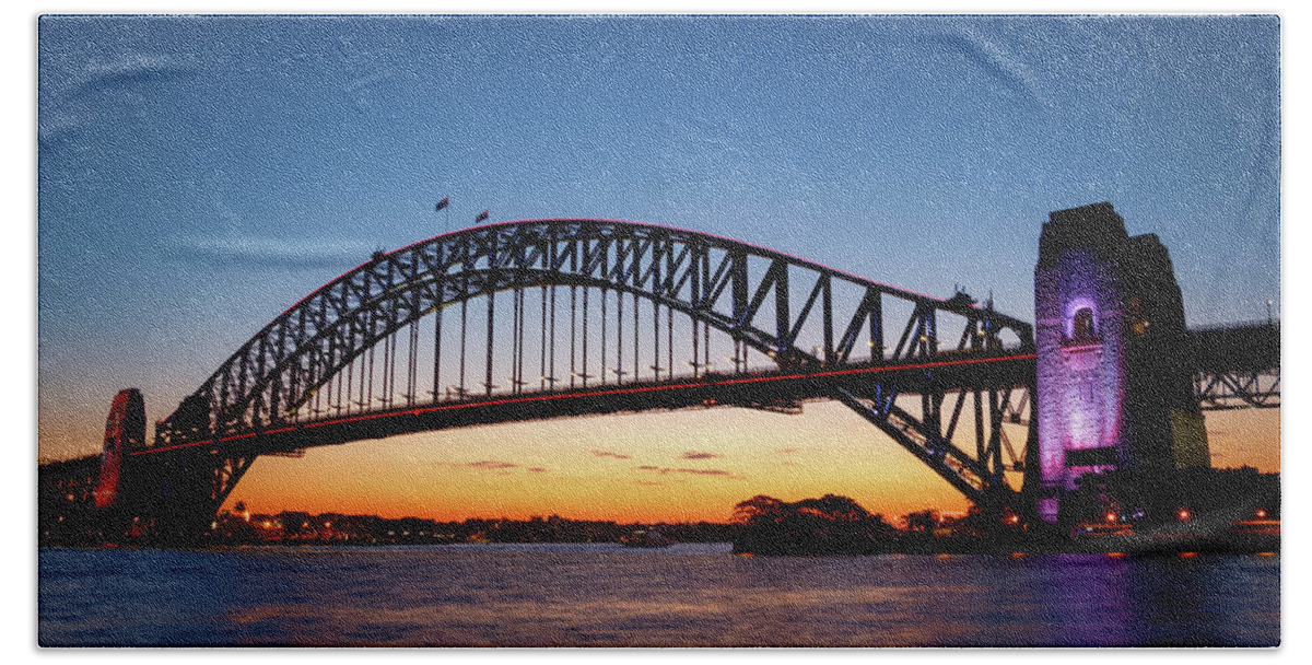Arch Hand Towel featuring the photograph Sydney Harbour Bridge illuminated at sunset by Rick Deacon