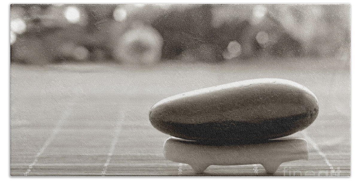 Meditative Bath Towel featuring the photograph Symbolic Zen Inspired Stone in a Spa by Olivier Le Queinec