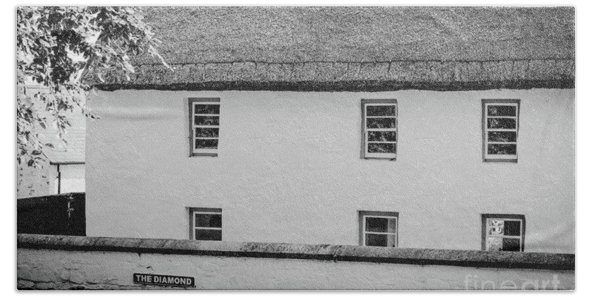 Thatched Building Bath Towel featuring the photograph Thatched Building on the Diamond bw by Eddie Barron